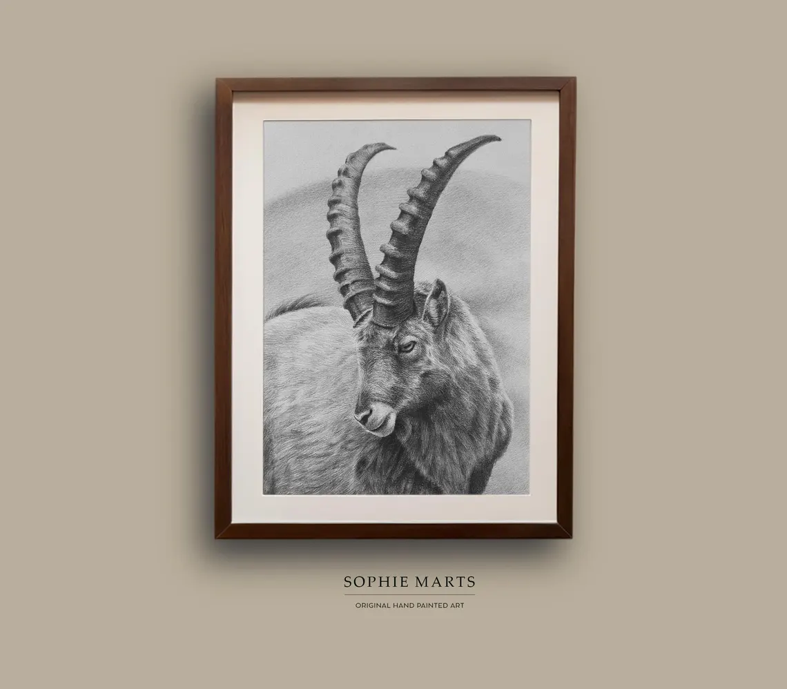This original pencil drawing depicts a powerful Capricorn mountain goat, symbol of strength, resilience, and determination. Created with graphite pencils on paper, the artwork captures the fine textures of fur and the majestic curve of the horns in realistic detail.
