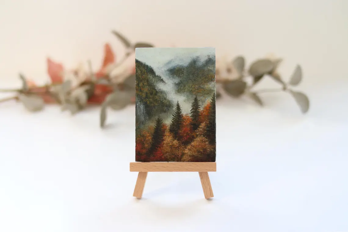 Distant misty mountain hills and fading autumn light, close-up detail in original acrylic miniature painting